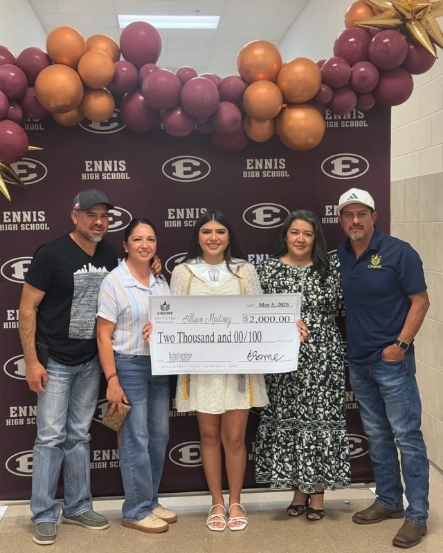 A scholarship recipient celebrating with her family